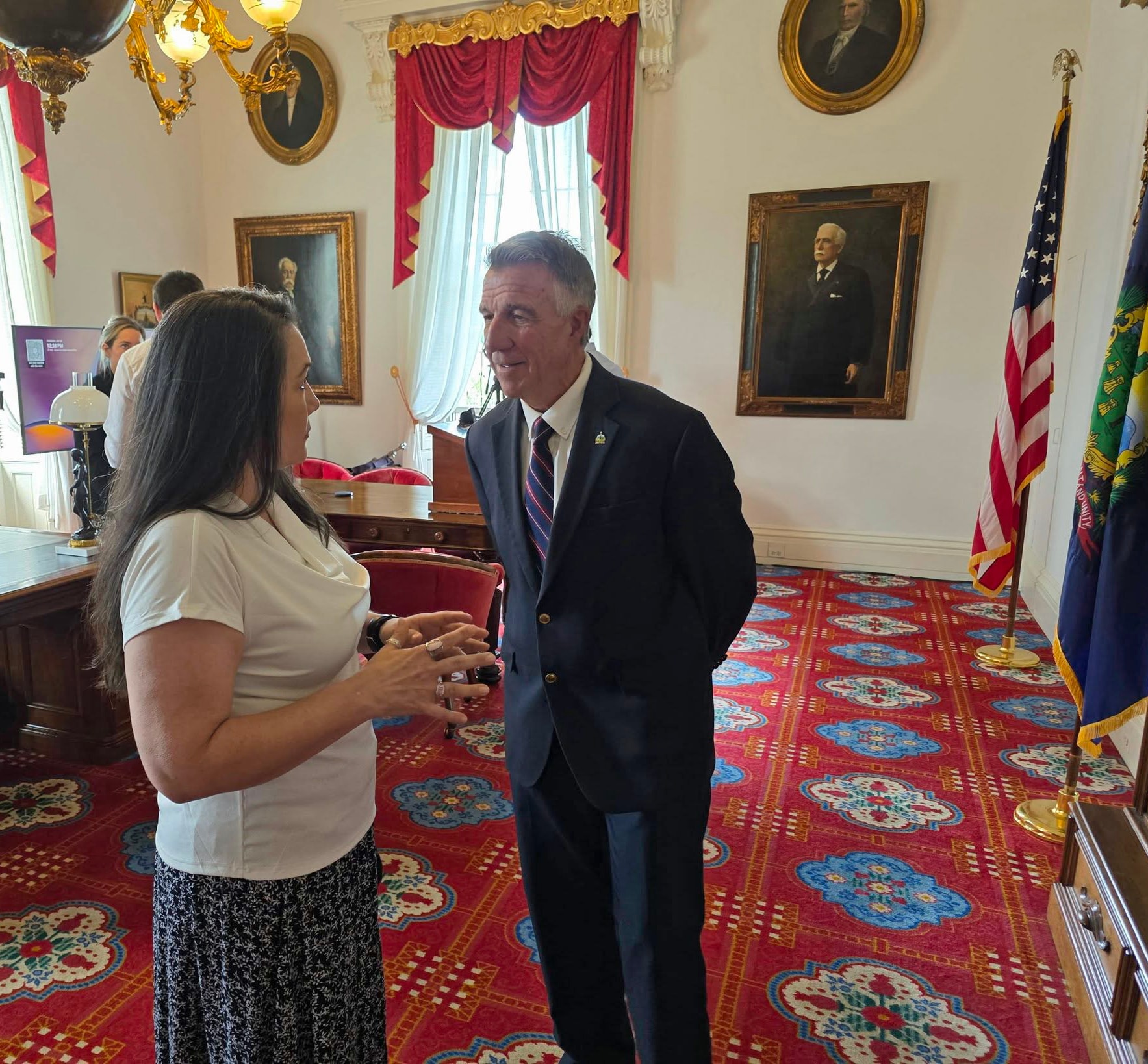 Andrea Murray in conversation with Governor Scott at the Vermont State House