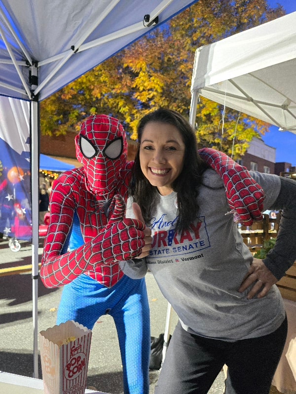 Andrea Murray posing with Spider-Man at the Windsor Autumn Moon Festival campaign booth